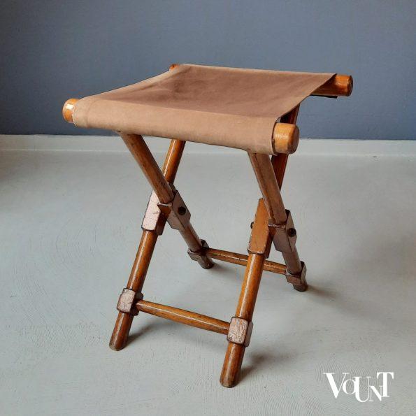 Antieke vouwkruk met canvas bekleding